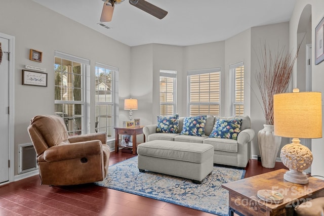 living room with ceiling fan and dark hardwood / wood-style floors