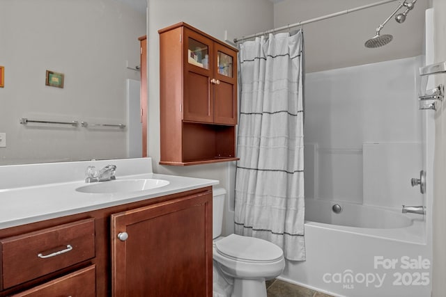 full bathroom featuring tile patterned floors, shower / bathtub combination with curtain, vanity, and toilet