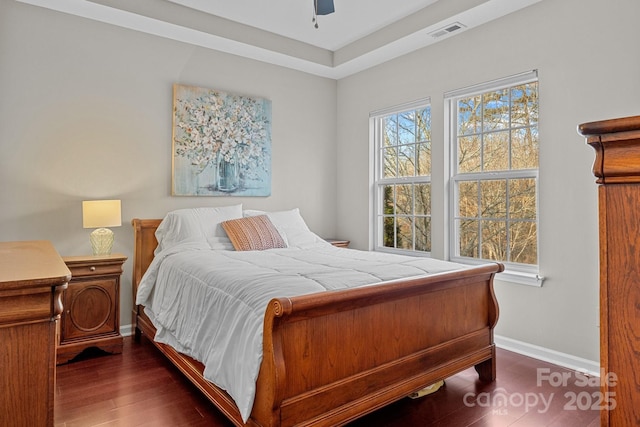 bedroom featuring ceiling fan and dark hardwood / wood-style floors