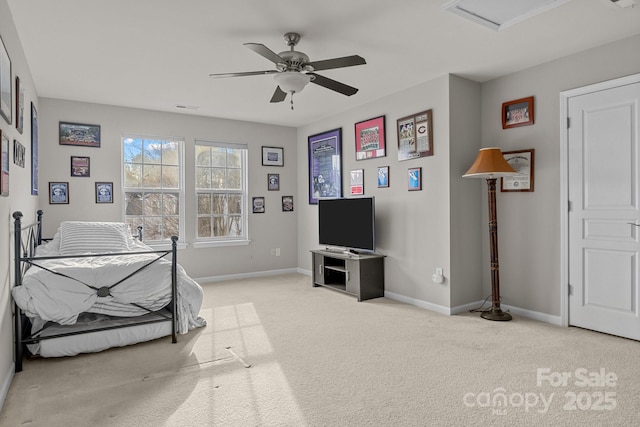 bedroom featuring ceiling fan and light carpet