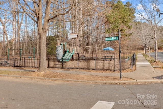 view of home's community featuring a playground