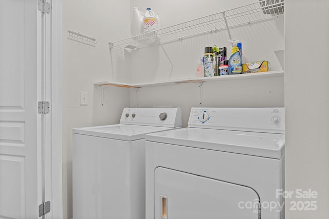 laundry room featuring washer and clothes dryer