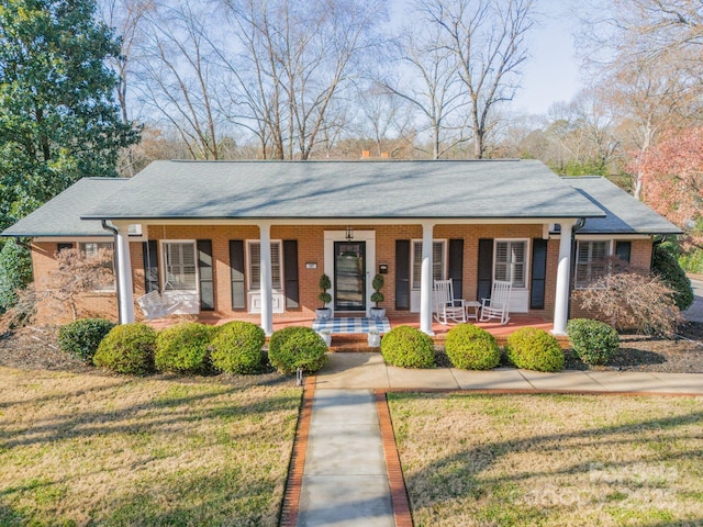 view of front of property with a front lawn and a porch