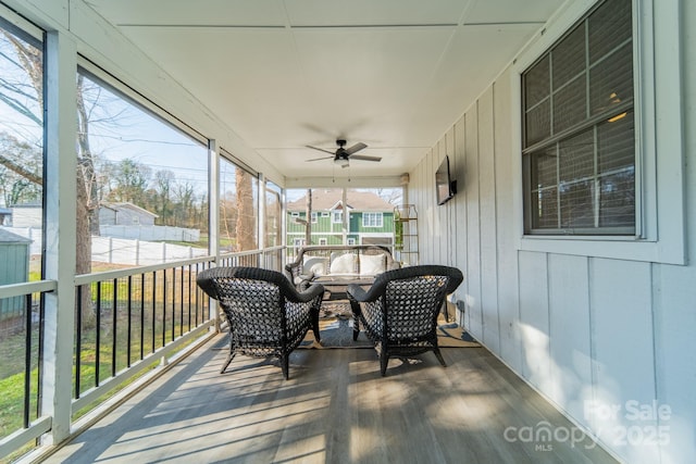 sunroom / solarium with ceiling fan