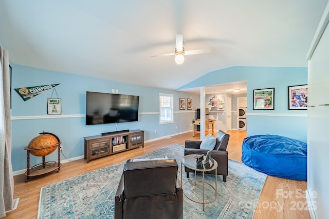 living room featuring hardwood / wood-style flooring, ceiling fan, and lofted ceiling