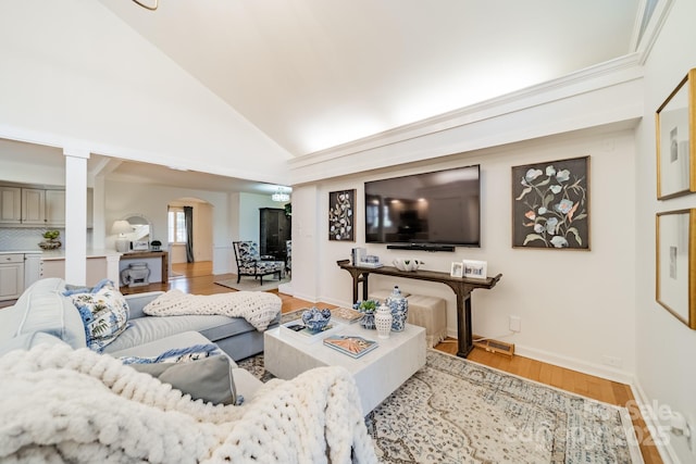 living room featuring vaulted ceiling and light wood-type flooring