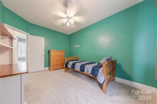 carpeted bedroom with ceiling fan