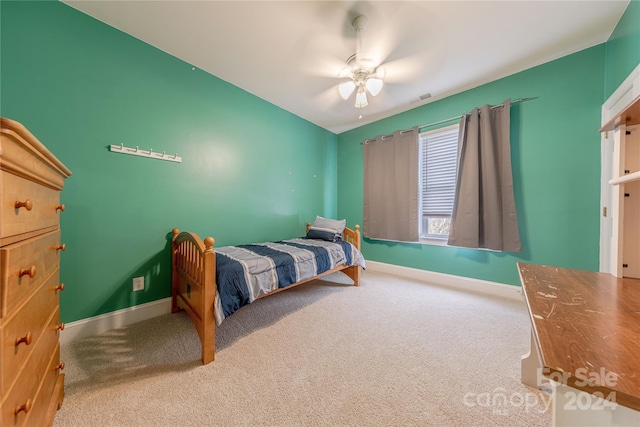 carpeted bedroom with ceiling fan