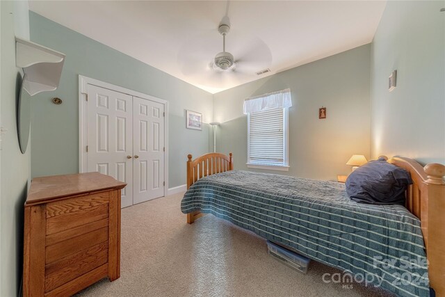 bedroom with ceiling fan and a closet