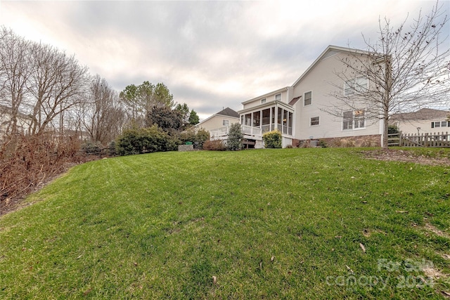 view of yard featuring a sunroom