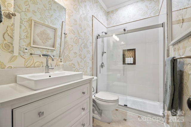 bathroom with walk in shower, tile patterned flooring, toilet, vanity, and ornamental molding