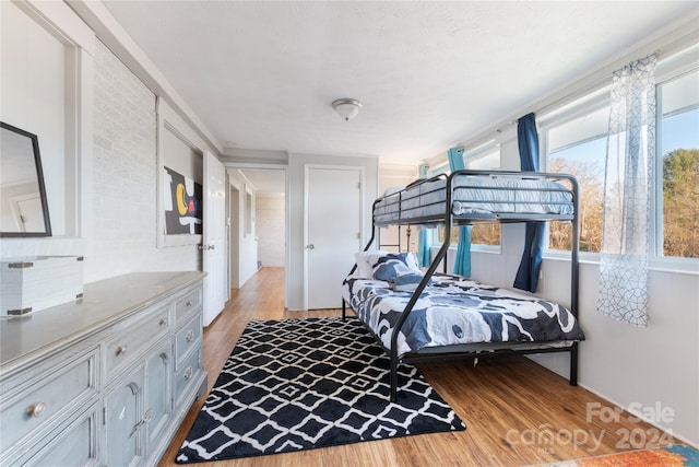 bedroom with light wood-type flooring