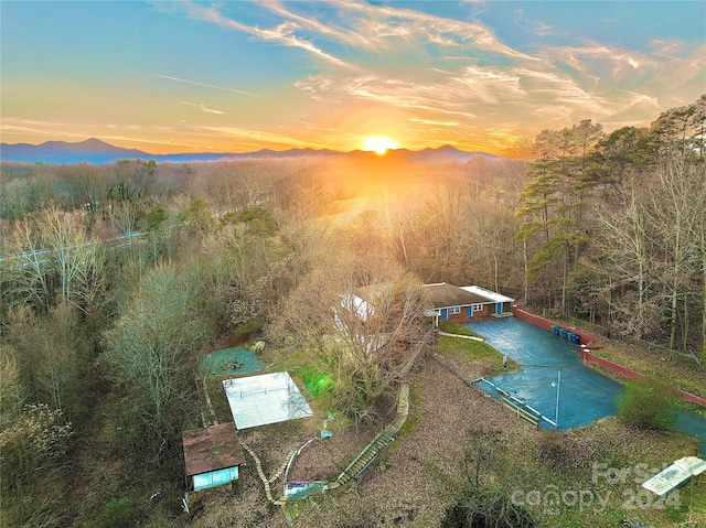 aerial view at dusk with a mountain view