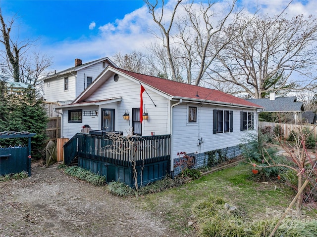 rear view of property with a deck