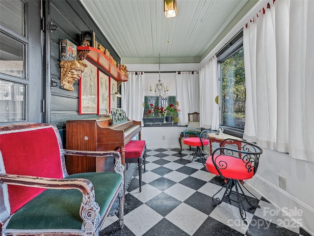 sunroom with a notable chandelier and wood ceiling