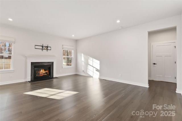 unfurnished living room featuring dark hardwood / wood-style flooring