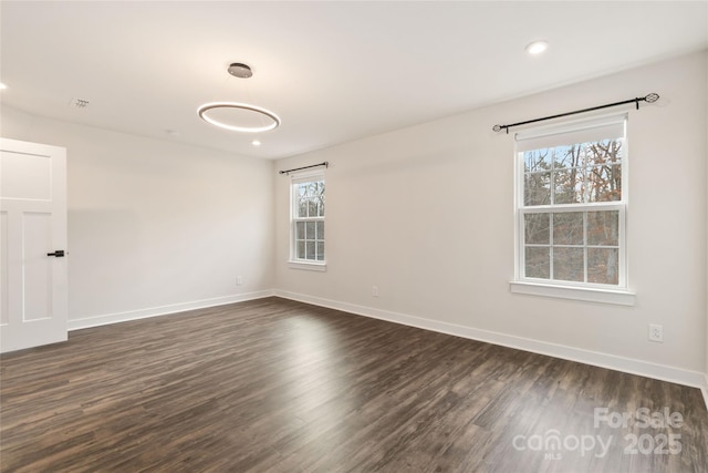 empty room featuring dark hardwood / wood-style floors