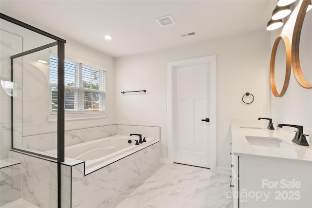 bathroom featuring vanity and plus walk in shower