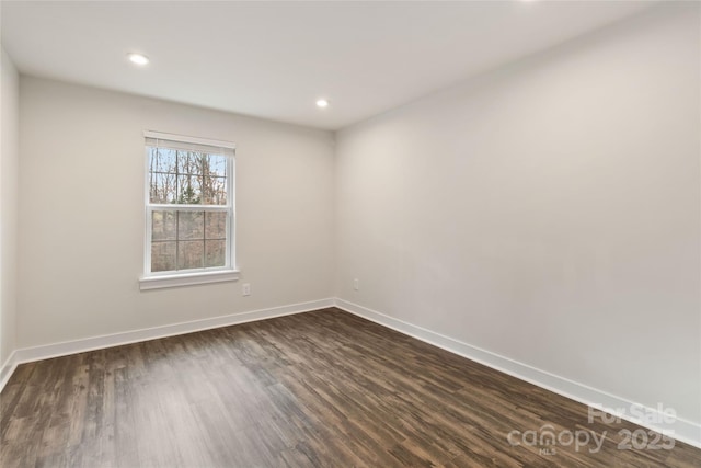 spare room featuring dark hardwood / wood-style floors