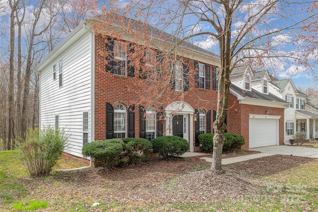 view of front of property featuring brick siding, concrete driveway, and an attached garage