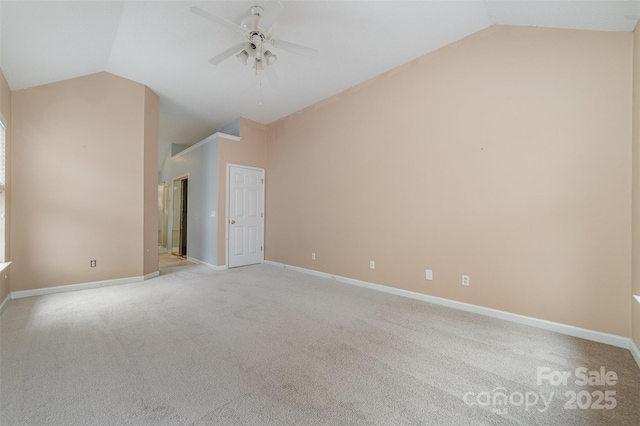 unfurnished room with baseboards, a ceiling fan, and vaulted ceiling