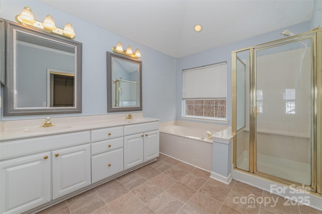 full bath featuring a shower stall, a bath, double vanity, and a sink