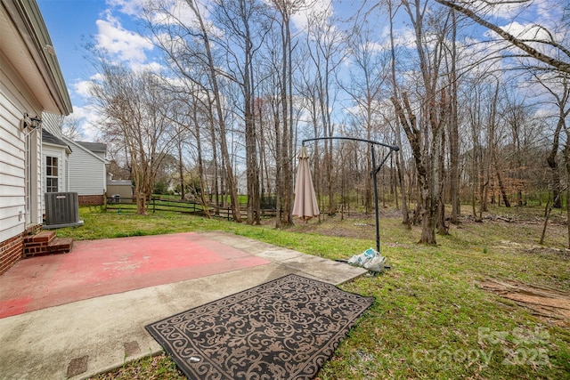 view of yard with cooling unit, a patio, and fence