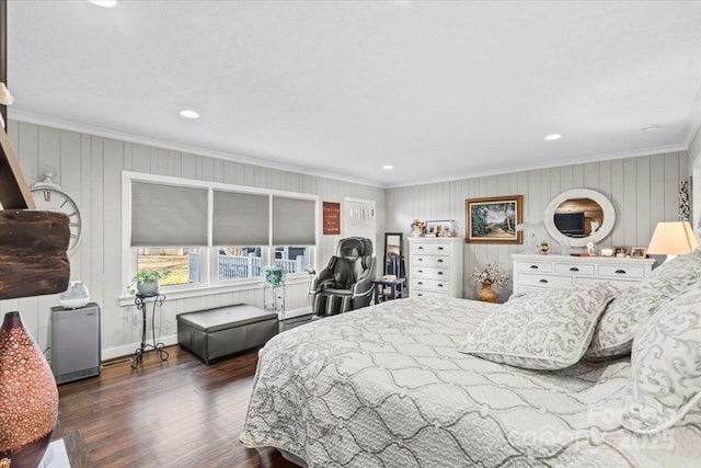 bedroom with dark hardwood / wood-style flooring and crown molding