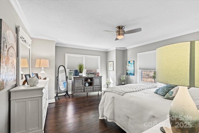 bedroom with a textured ceiling, dark wood-type flooring, ceiling fan, and crown molding