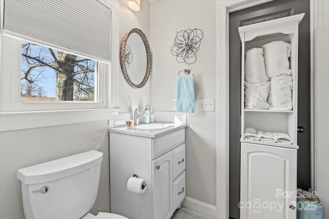 bathroom with vanity and toilet