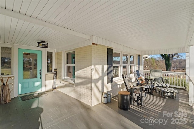 wooden deck featuring covered porch