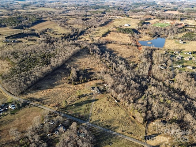 aerial view featuring a rural view and a water view