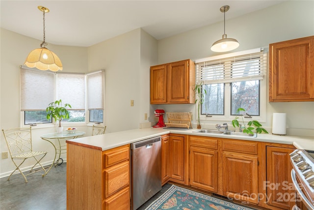 kitchen featuring hanging light fixtures, kitchen peninsula, sink, and stainless steel appliances