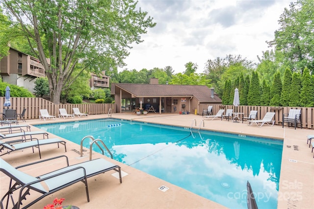 view of pool featuring a patio