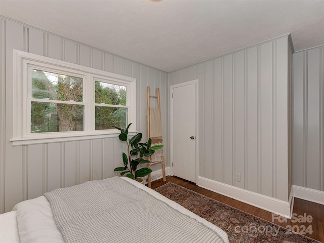 bedroom featuring dark wood-type flooring