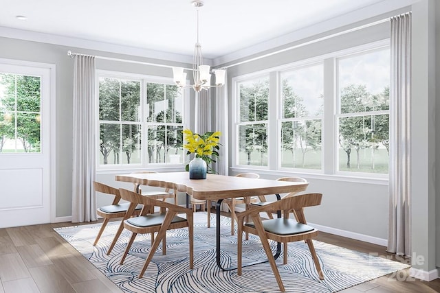 sunroom / solarium featuring plenty of natural light and an inviting chandelier