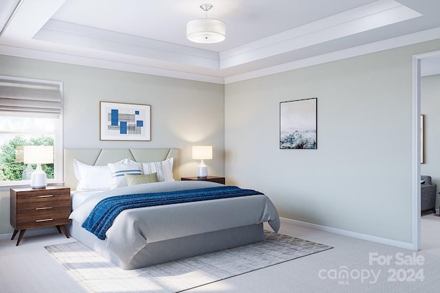 bedroom featuring light carpet and a tray ceiling