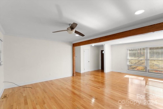 spare room featuring light hardwood / wood-style flooring, ceiling fan, and ornamental molding