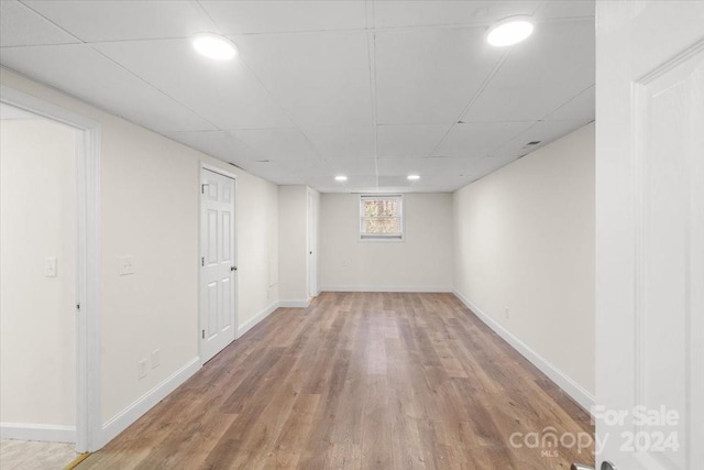 basement featuring hardwood / wood-style flooring