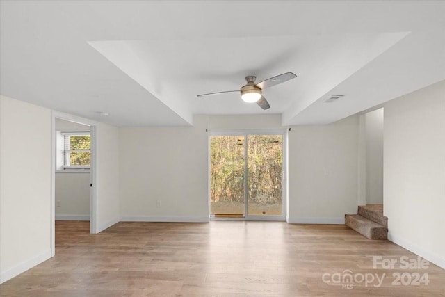 empty room featuring light wood-type flooring and ceiling fan