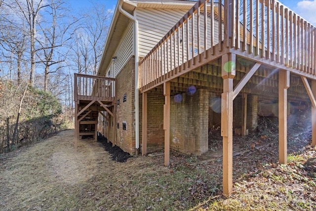 view of side of home with a deck