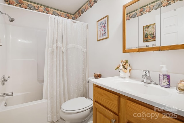 full bathroom featuring vanity, toilet, and shower / bath combo with shower curtain