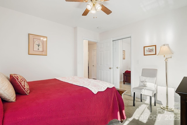 bedroom with ceiling fan, a closet, and carpet