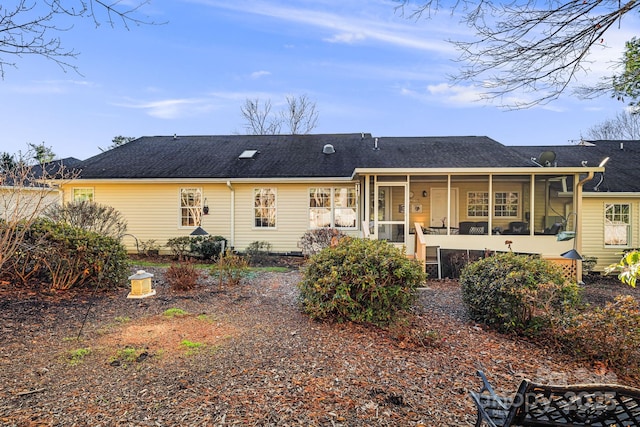 rear view of house with a sunroom