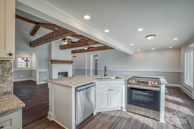 kitchen with white cabinets, lofted ceiling with beams, sink, light stone countertops, and appliances with stainless steel finishes