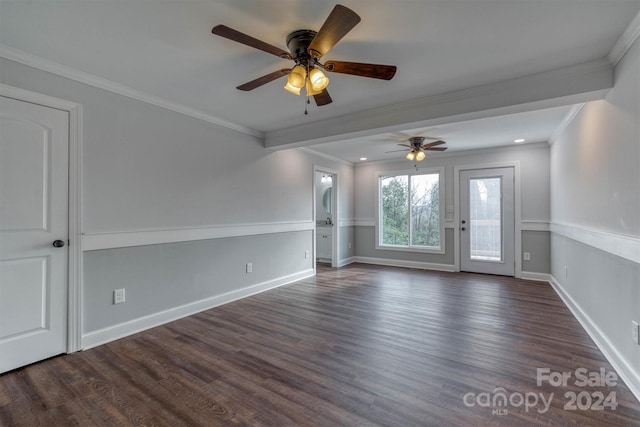 spare room featuring crown molding, dark hardwood / wood-style flooring, and ceiling fan