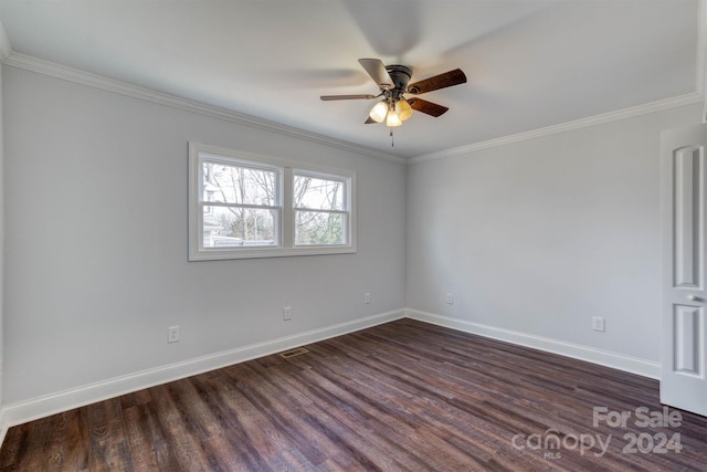 spare room with dark wood-type flooring, ceiling fan, and crown molding