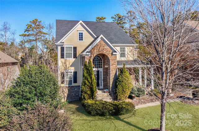 view of property featuring a front yard