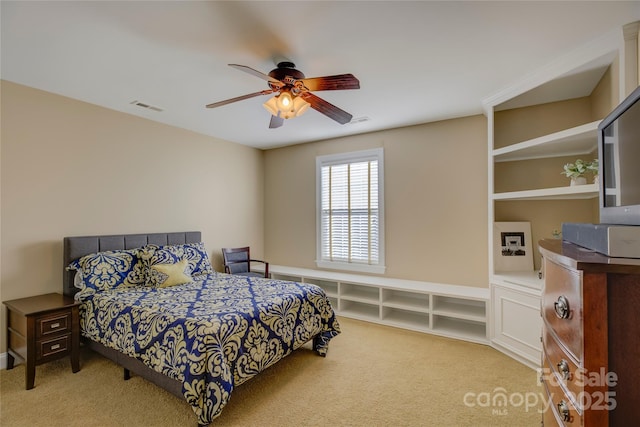 bedroom with light colored carpet and ceiling fan