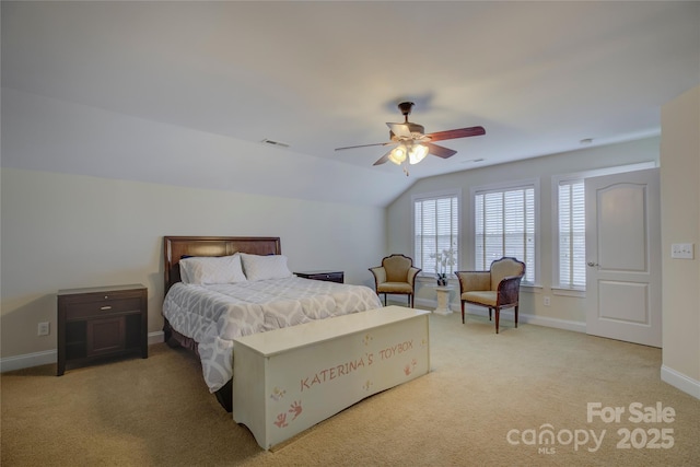 bedroom featuring ceiling fan, light colored carpet, and vaulted ceiling